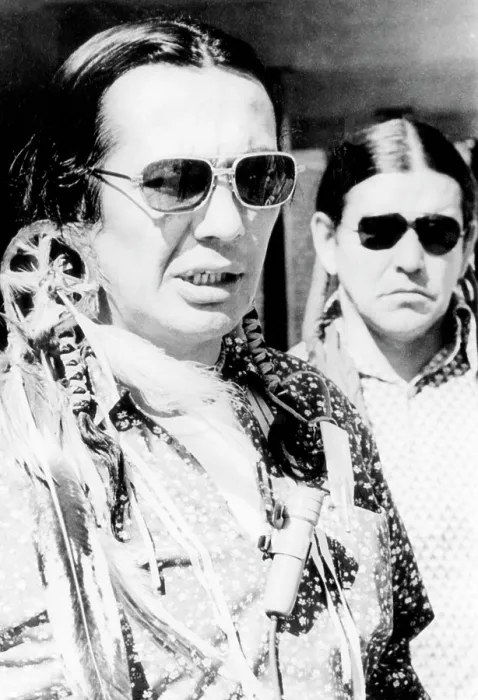 Framed Print : Russell Means, and Clyde Bellecourt, of AIM (American Indian Movement), after being arraigned in Federal Court for AIM's occupation of Wounded Knee. April 16, 1973 Framed Print : Russell Means, and Clyde Bellecourt, of AIM (American Indian Movement), after being arraigned in Federal Court for AIM's occupation of Wounded Knee. April 16, 1973