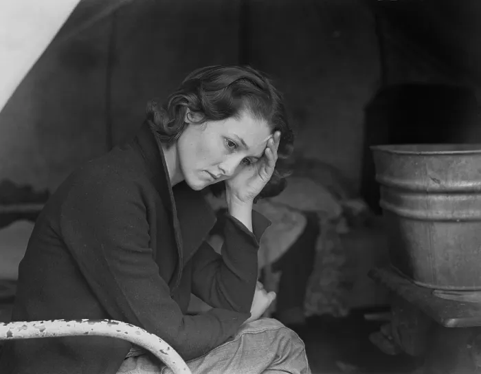 Framed Print : Sad daughter of unemployed Tennessee coal miner in California migrant workers camp near Sacramento, California, during the Great Depression. Photo by Dorothea Lange, 1936
