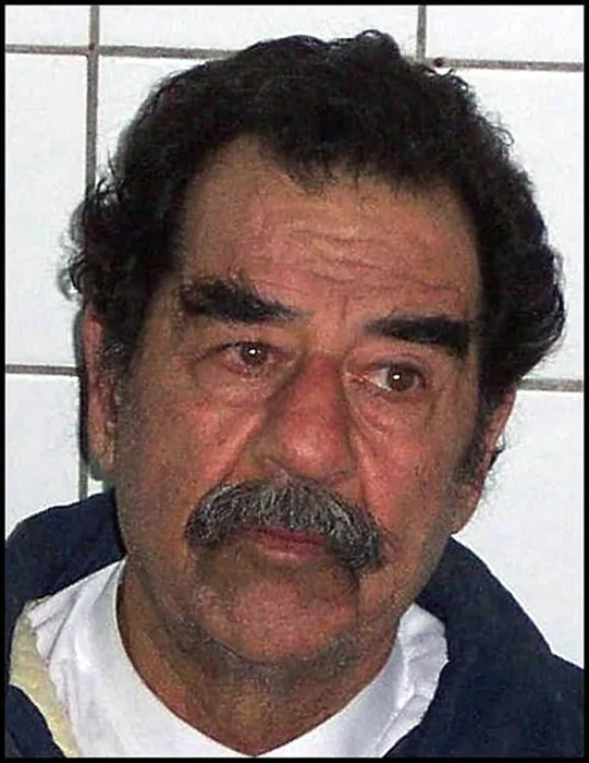 Framed Print : Saddam Hussein shortly after his capture by US forces in Tikrit Iraq. Dec. 14 2003. (BSLOC_2011_12_140)
