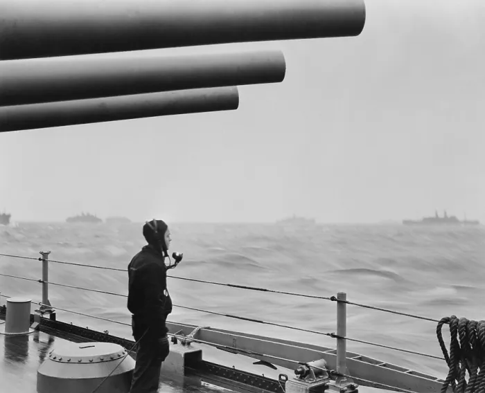 Framed Print : A sailor on a warship keeps alert watch over merchant ships in a convoy. U.S. warships protected convoys of 30 to 70 ships on the Atlantic during World War 2. Ca. 1941-45 Framed Print : A sailor on a warship keeps alert watch over merchant ships in a convoy. U.S. warships protected convoys of 30 to 70 ships on the Atlantic during World War 2. Ca. 1941-45
