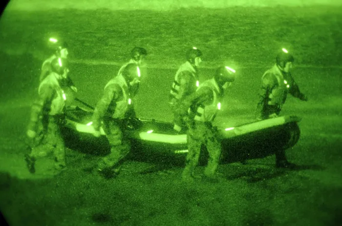 Framed Print : US Sailors assigned to Basic Underwater Demolition / SEAL training class carry an inflatable boat toward the surf in San Diego California. Feb. 25 2010. (BSLOC_2011_12_267) Framed Print : US Sailors assigned to Basic Underwater Demolition / SEAL training class carry an inflatable boat toward the surf in San Diego California. Feb. 25 2010. (BSLOC_2011_12_267)
