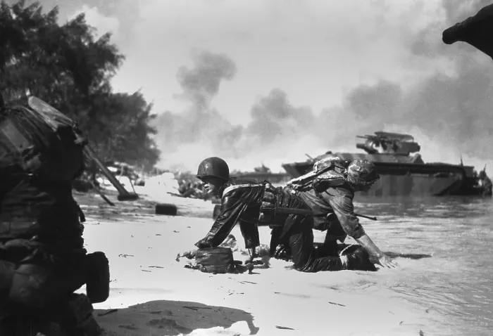 Framed Print : On Saipan, invading Marines under Japanese fire crawl to their assigned positions, June 1944. Many Marines landed on the wrong beaches, and had to get to their units