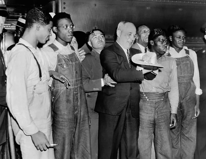 Framed Print : Scottsboro Boys and radical lawyer Samuel Leibowitz cheer at Penn Station