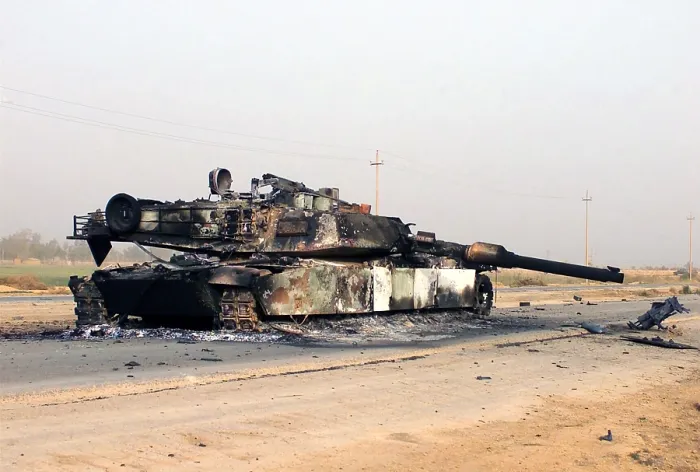 Framed Print : A scuttled Abrams Tank rests in front of a Fedayeen camp just outside of Jaman Al Juburi Iraq during the Second Gulf War Framed Print : A scuttled Abrams Tank rests in front of a Fedayeen camp just outside of Jaman Al Juburi Iraq during the Second Gulf War