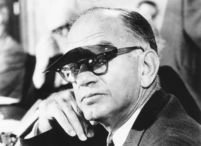 Framed Print : Sen. J. William Fulbright wears a sun visor to shield his eyes from the TV lights. Mar. 11, 1969