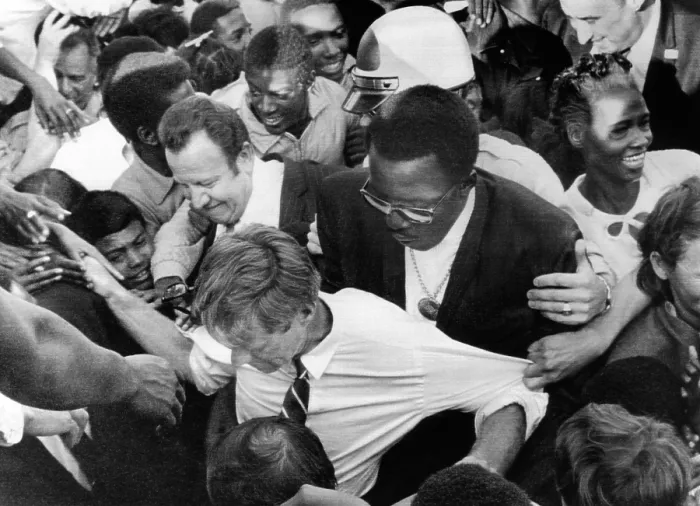Framed Print : Sen. Robert Kennedy tugged at from every direction