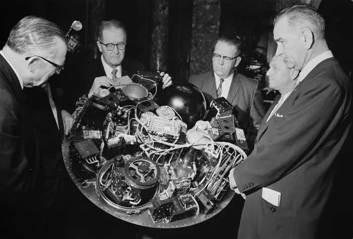 Framed Print : Senate Majority Leader Lyndon Johnson is shown the complex satellite circuitry of TIROS I, by NASA's William Stroud