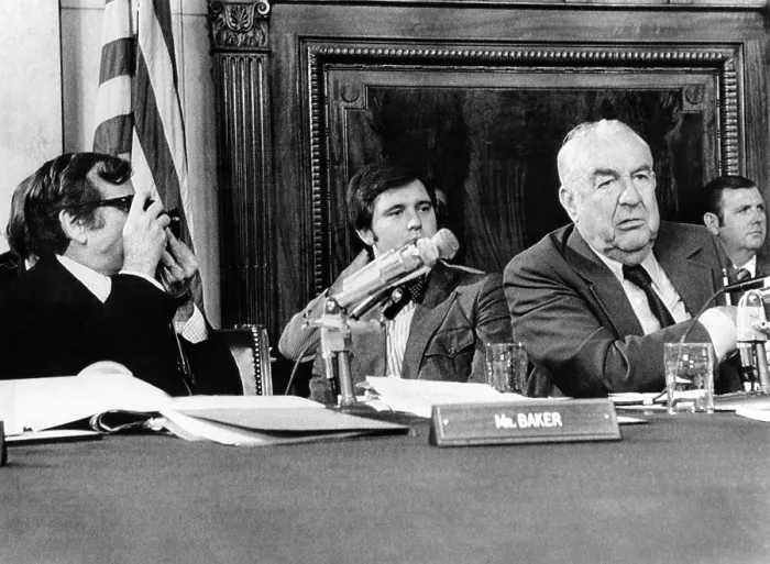 Framed Print : Senate Watergate Committee. Vice Chairman Howard Baker, an amateur photographer, borrowed a newsman's camera to take a picture of Chairman Sam Ervin. July 13, 1973