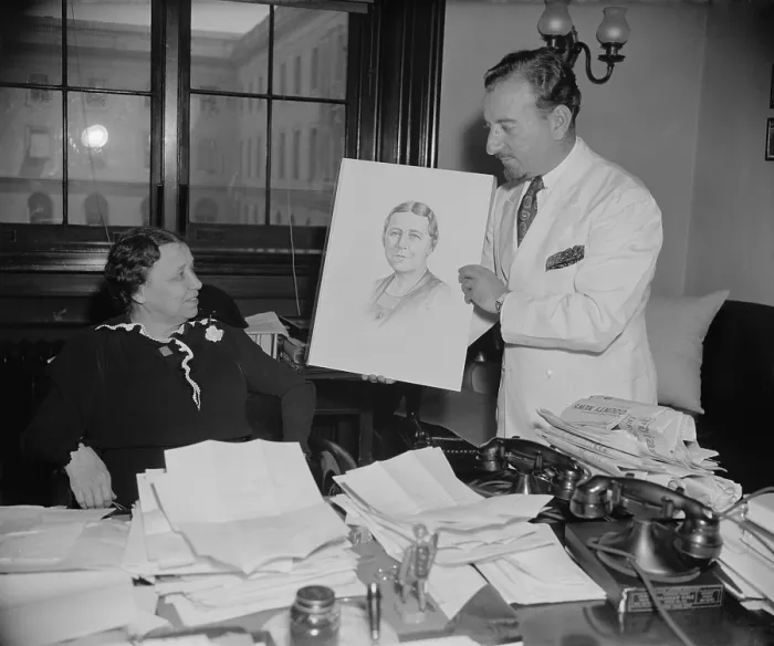 Framed Print : Senator Hattie W. Caraway, Democrat of Arkansas, choosing the official portrait for her 1937 re-election campaign
