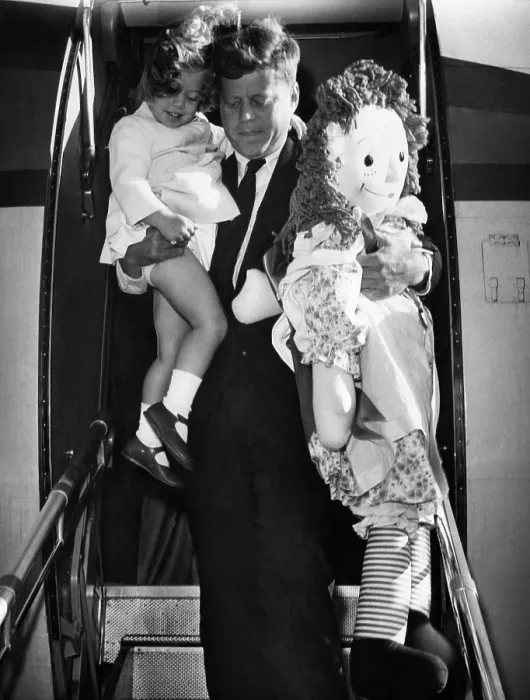 Framed Print : Senator John F. Kennedy (right), and Caroline Kennedy (left), exiting a plane