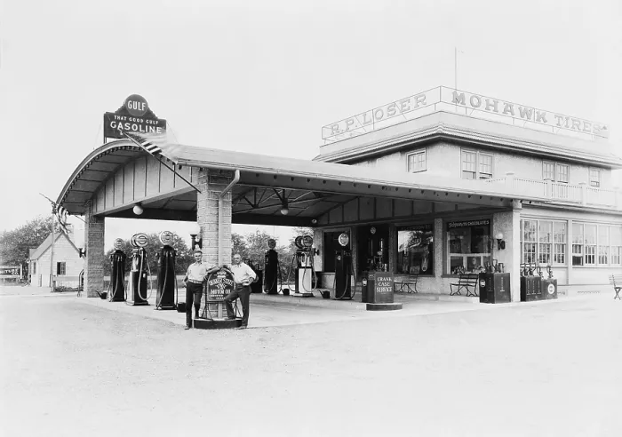 Framed Print : Service station in Avon, Pennsylvania with gasoline pumps and station attendants. Ca. 1940s