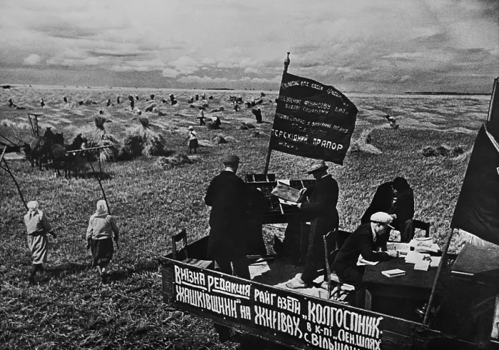 Framed Print : Setting the district newspaper, Collective Farmer in the fields of a Soviet farm. Ca. 1935-40. Near Kiev, Ukraine, USSR. (BSLOC_2015_2_253)