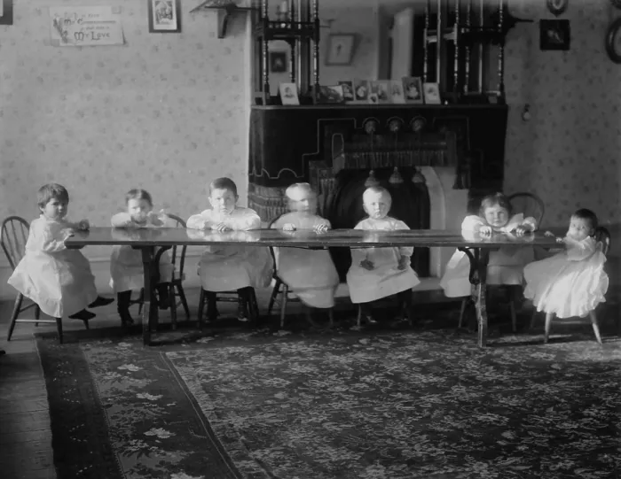 Framed Print : Seven toddlers sit at a table at the Childrens Aid Society