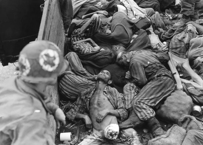 Framed Print : Seventh US Army Medical Corpsman looks into train car filled with slain or starved prisoners