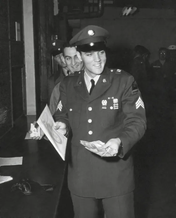 Framed Print : Sgt. Elvis A. Presley, 32nd Armored, 3rd Armored Div. collecting his last pay as he re-enters civilian life. March 5, 1960. - (BSLOC_2014_17_108)