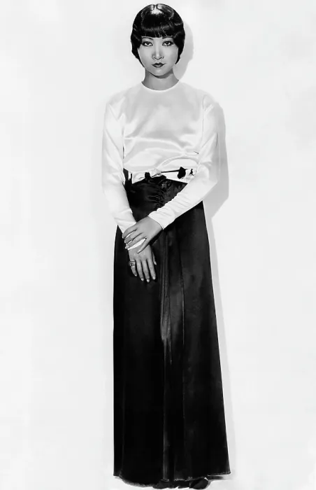 Framed Print : SHANGHAI EXPRESS, Anna May Wong, in brown-and-white satin pajamas by Travis Banton, 1932