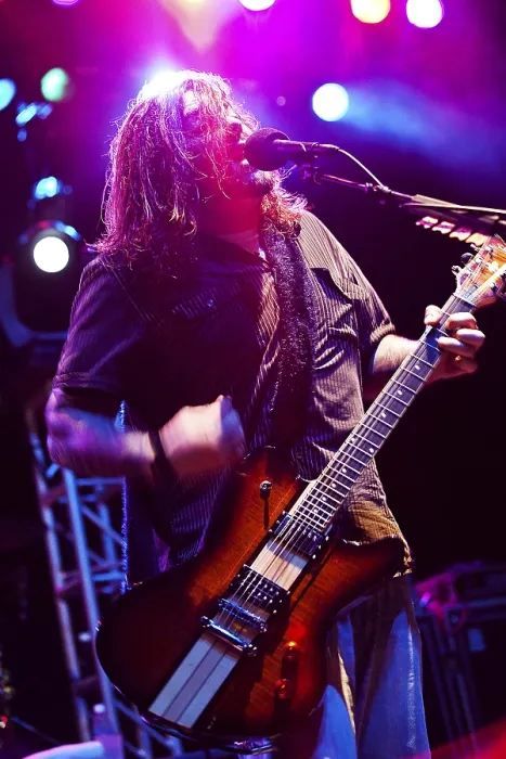 Framed Print : Shaun Morgan Welgemoed of the rock group Seether plays for Marines Sailors and their families during a concert on Marine Corps Base Hawaii. Dec. 17 2010. (BSLOC_2011_12_379)