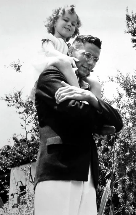 Framed Print : Shirley Temple being carried by her brother Jack Temple, 7 / 21 / 34. Courtesy: CSU Archives / Everett Collection Framed Print : Shirley Temple being carried by her brother Jack Temple, 7 / 21 / 34. Courtesy: CSU Archives / Everett Collection
