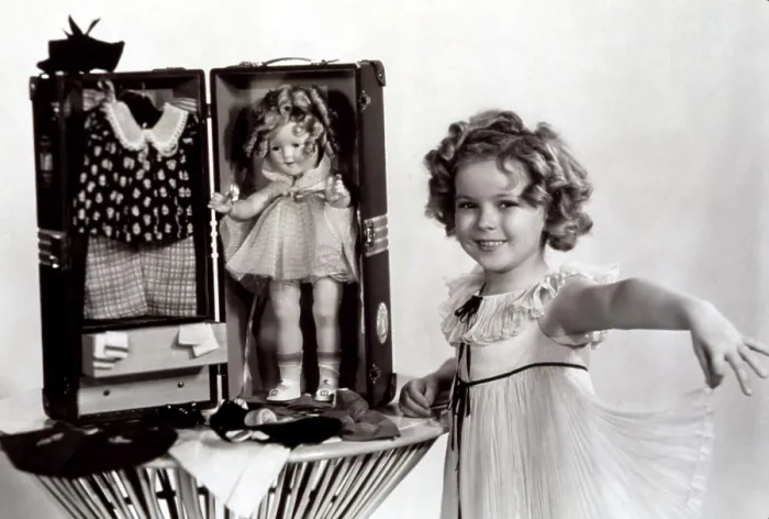 Framed Print : Shirley Temple with a Shirley Temple doll kit, 1935. Courtesy: CSU Archives / Everett Collection Framed Print : Shirley Temple with a Shirley Temple doll kit, 1935. Courtesy: CSU Archives / Everett Collection
