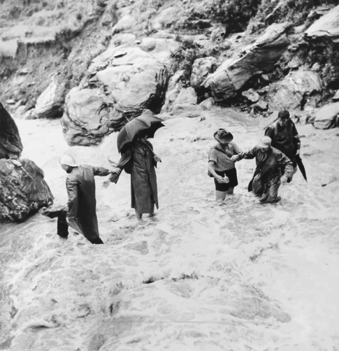 Framed Print : Sir Edmund Hillary's Himalayan expedition crossing a mountain torrent. Sir Edmund Hillary is at extreme right