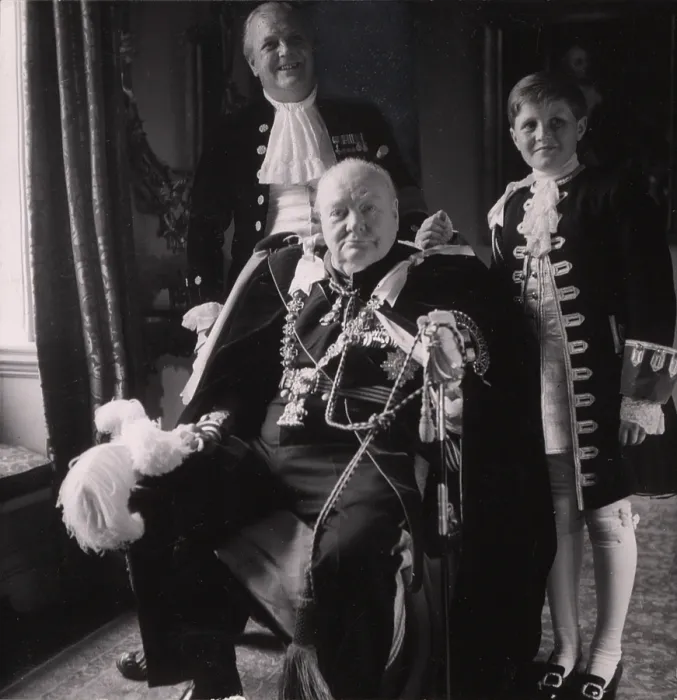 Framed Print : Sir Winston Churchill (front), his son Randolph Churchill (back left), and his grandson Winston Churchill (right), in Coronation robes, photo by Toni Frissell, 1953 Framed Print : Sir Winston Churchill (front), his son Randolph Churchill (back left), and his grandson Winston Churchill (right), in Coronation robes, photo by Toni Frissell, 1953