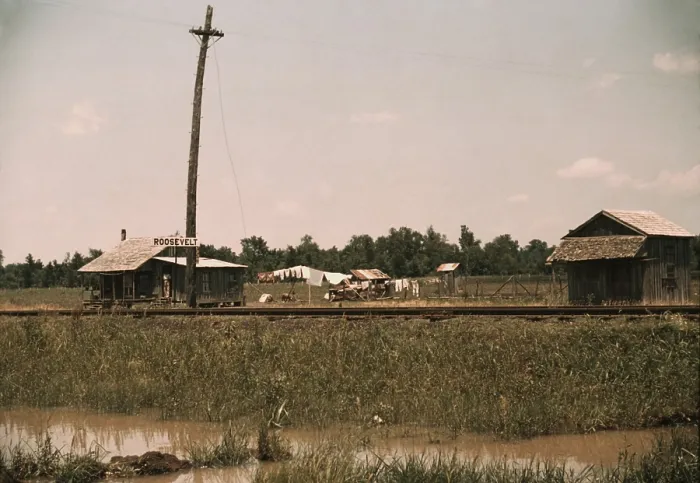 Framed Print : Small Southern farmstead along the Railroad tracks displays a ROOSEVELT sign. A wire travels from the utility pole to the home, perhaps providing electricity