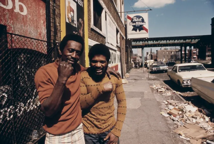 Framed Print : Smiling African American men on a garbage strewn street on the South Side of Chicago. Ca. 1975
