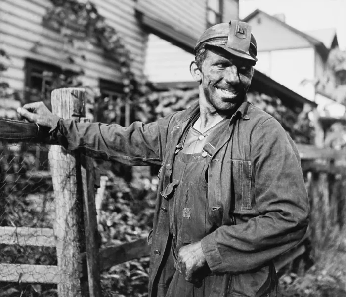 Framed Print : Smiling Polish-American miner, in work clothes and covered with coal dust, arriving home from work in Capels, West Virginia. 1938 photo by Marion Post Wolcott