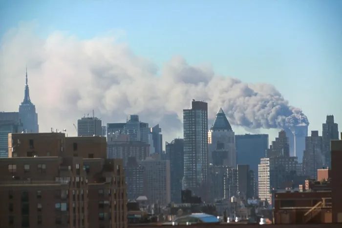 Framed Print : Smoke billowing from the Twin Towers following September 11th terrorist attack on World Trade Center