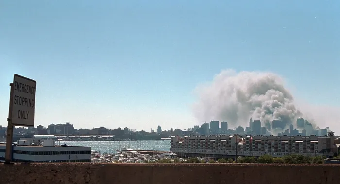 Framed Print : Smoke and pulverized building debris rise from the World Trade Center, Tuesday, Sept. 11, 2001. Photo taken from New Jersey after the North Tower collapsed at 10:28 AM Framed Print : Smoke and pulverized building debris rise from the World Trade Center, Tuesday, Sept. 11, 2001. Photo taken from New Jersey after the North Tower collapsed at 10:28 AM