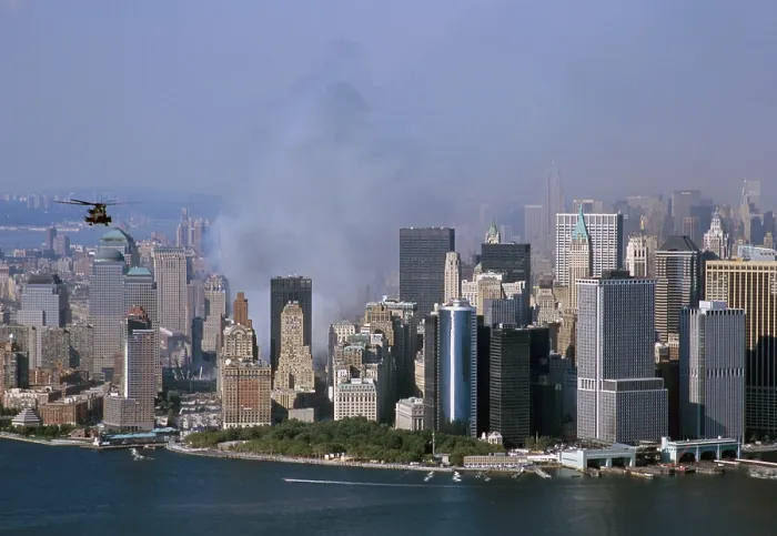 Framed Print : Smoke from the ruins of the World Trade Center two days after the 9 / 11 terrorists attacks north of New York City's Battery Part and Financial District office buildings. Sept