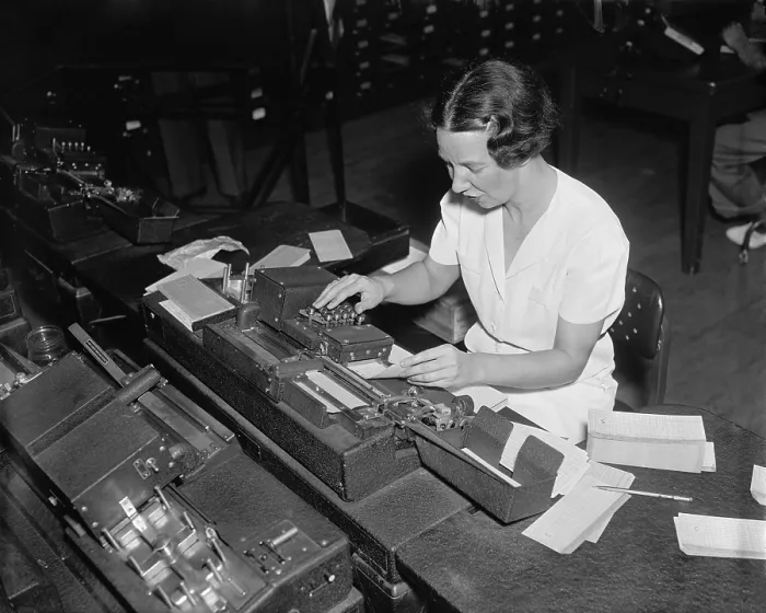 Framed Print : Social Security Administration clerk punching tabulator operation cards, with each hole representing a letter or a numbers Framed Print : Social Security Administration clerk punching tabulator operation cards, with each hole representing a letter or a numbers