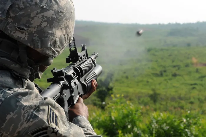 Framed Print : US soldier fires a practice round out of a M203 grenade launcher at Marine Corps Base Quantico Virginia. July 15 2010. (BSLOC_2011_12_306)