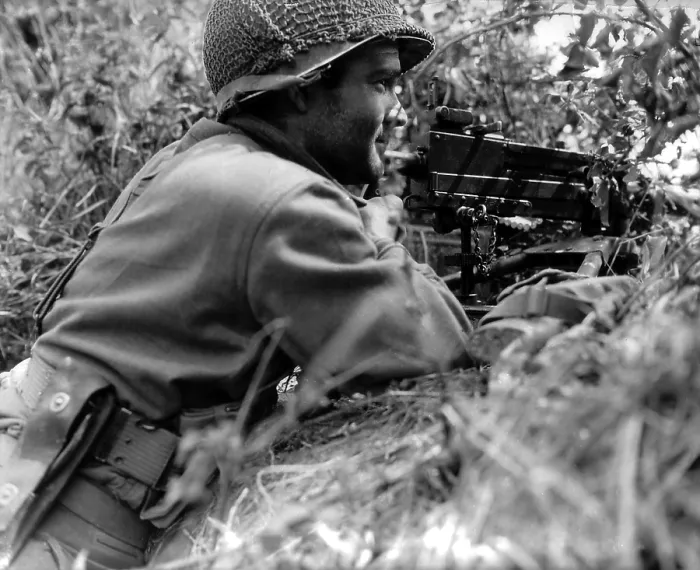 Framed Print : Soldier positioned in a ditch with gun Browning machine gun in Normandy, France. He is part of Operation Cobra, code name for First U.S Framed Print : Soldier positioned in a ditch with gun Browning machine gun in Normandy, France. He is part of Operation Cobra, code name for First U.S