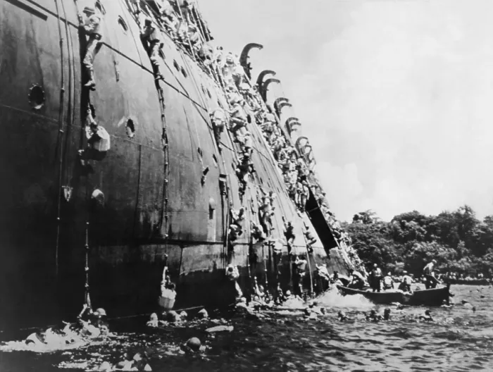 Framed Print : Soldiers abandoning the sinking SS President Coolidge in Espiritu Santo Harbor. She hit a U.S Framed Print : Soldiers abandoning the sinking SS President Coolidge in Espiritu Santo Harbor. She hit a U.S