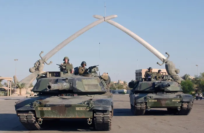 Framed Print : Soldiers in an Army Abrams Tank pose for a photo under the Hands of Victory in Ceremony Square Baghdad Iraq