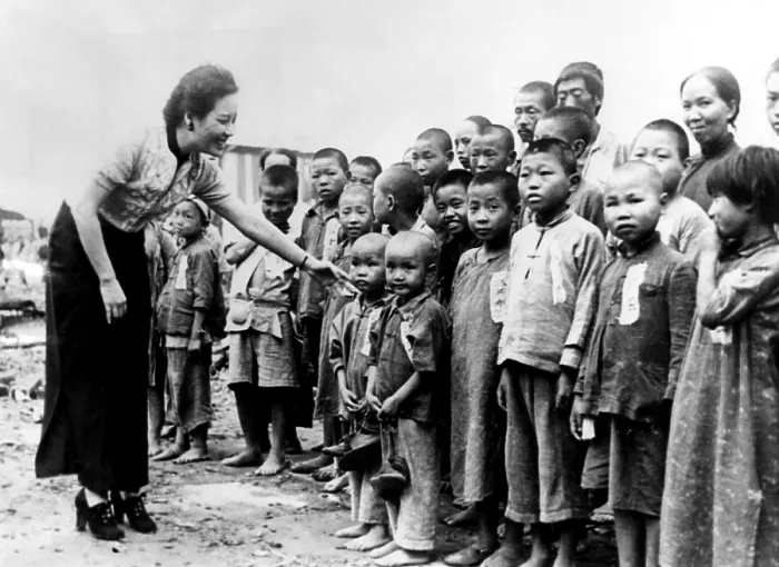 Framed Print : Soong Mei-ling, wife of General Chiang Kai-shek, greets some of the 200 orphans she adopted in Chungking, China Framed Print : Soong Mei-ling, wife of General Chiang Kai-shek, greets some of the 200 orphans she adopted in Chungking, China