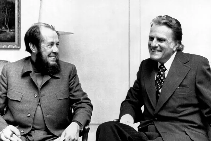 Framed Print : Soviet author Alexander Solzhenitsyn and evangelist Billy Graham discuss world religious trends suring a metting in Stockholm, Sweden. December 1974 Framed Print : Soviet author Alexander Solzhenitsyn and evangelist Billy Graham discuss world religious trends suring a metting in Stockholm, Sweden. December 1974