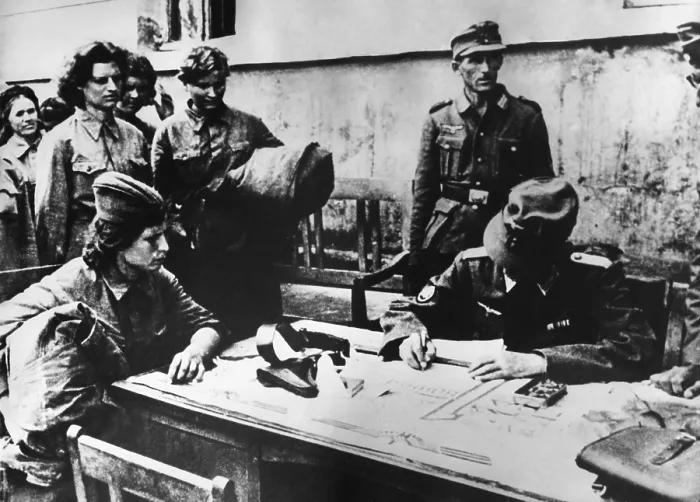 Framed Print : Soviet (Russia) woman soldier POW is interrogated by a German officer. Soviet women medics and nurses served on the front lines. April 1942. World War 2. (BSLOC_2014_8_46)