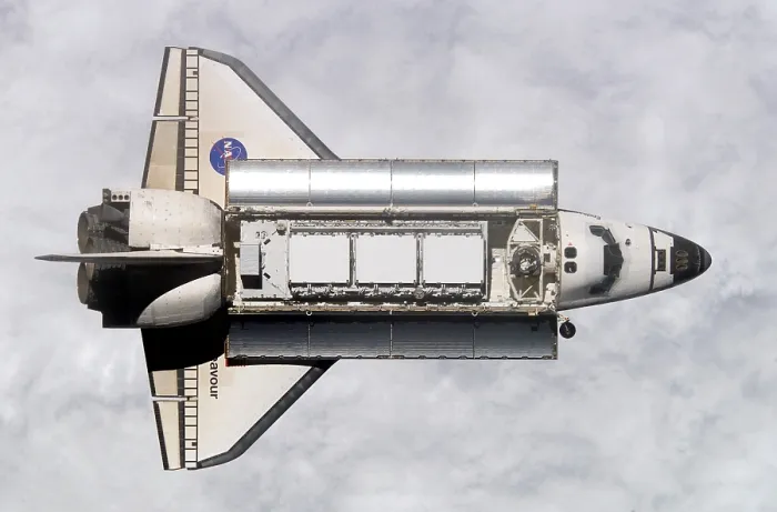 Framed Print : Space shuttle Endeavour approaching the International Space Station. Within the cargo bay are modules for expanding the space station. Nov. 25, 2002