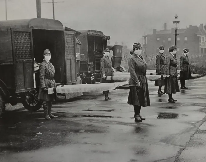 Framed Print : Spanish Flu Epidemic 1918-1919 in America. Masked American Red Cross Motor Corps women hold stretchers near ambulances for transport of severe influenza cases. St