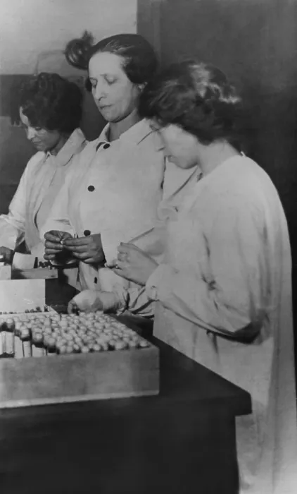 Framed Print : Spanish Flu Epidemic 1918-1919 in America. Three women packing influenza antitoxin for shipment to American cities during the epidemic, c. 1920 (BSLOC_2016_11_120) Framed Print : Spanish Flu Epidemic 1918-1919 in America. Three women packing influenza antitoxin for shipment to American cities during the epidemic, c. 1920 (BSLOC_2016_11_120)