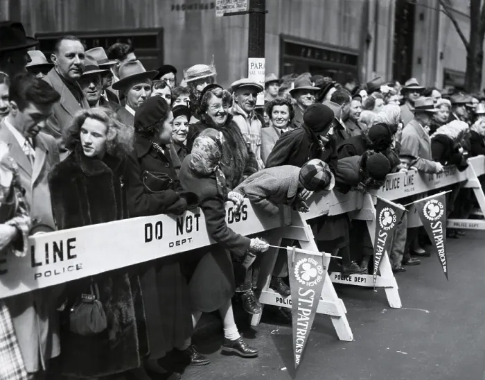 Framed Print : Spectators lean over barricades to watch the approaching St. Patrick's Day Parade in NYC, 1951 (BSLOC_2018_1_65)