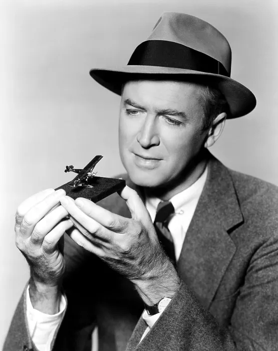 Framed Print : THE SPIRIT OF ST. LOUIS, star James Stewart, admiring a 14-carat gold replica of Charles Lindbergh's titular plane, 1957