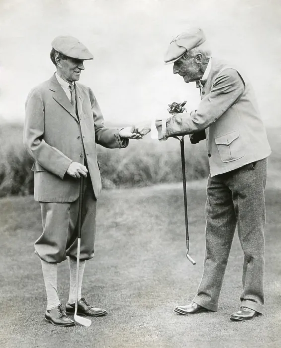 Framed Print : A splendid long putt deserves a dime'. John D. Rockefeller hands Harvey Firestone a dime during a golf match at Orvond Beach, Florida. Jan. 31, 1930. - (BSLOC_2014_14_2) Framed Print : A splendid long putt deserves a dime'. John D. Rockefeller hands Harvey Firestone a dime during a golf match at Orvond Beach, Florida. Jan. 31, 1930. - (BSLOC_2014_14_2)
