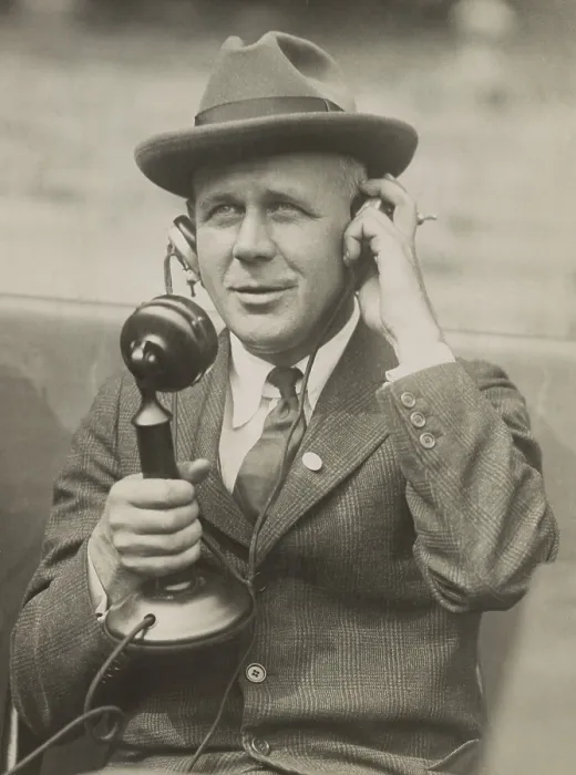 Framed Print : Sports Journalist Grantland Rice using telephone microphone in the 1920s. Rice wrote his syndicated column, THE SPORTLIGHT, for New York Tribune. (BSLOC_2015_17_148)