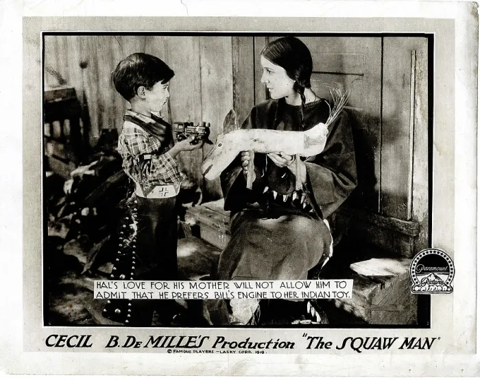 Framed Print : THE SQUAW MAN, l-r: Pat Moore, Ann Little on lobbycard, 1918