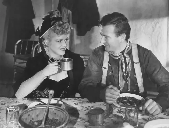 Framed Print : STAGECOACH, from left: Claire Trevor, John Wayne, 1939