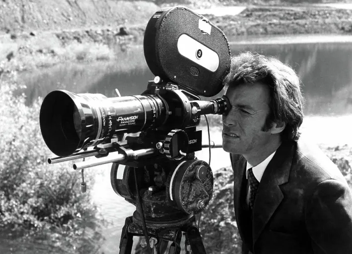 Framed Print : Star CLINT EASTWOOD checks a camera set up during production of DIRTY HARRY, 1971