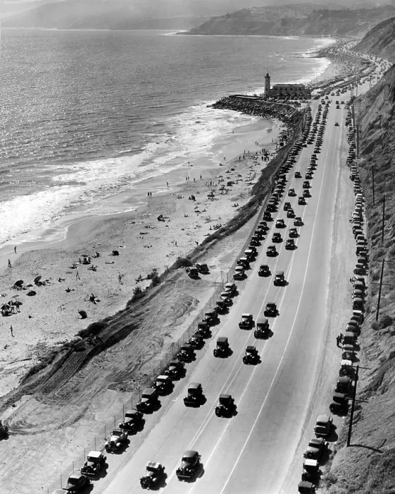 Framed Print : Start of the beach season. Thousands of cars drive on Roosevelt highway north from Santa Monica. Many are parked along the base of the mountains on the scenic Malibu coast Framed Print : Start of the beach season. Thousands of cars drive on Roosevelt highway north from Santa Monica. Many are parked along the base of the mountains on the scenic Malibu coast